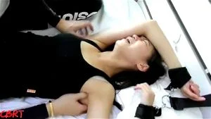 Chinese armpits in black tank top tickled