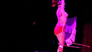 Sexy hula hooper puts on a strip show!!  AMAZING!!