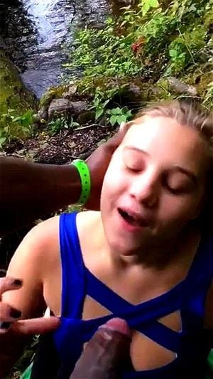 Blonde interracial blowjob in park