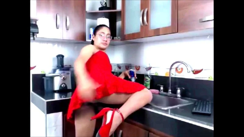 TS babe latina stroking big cock in red dress TS babe latina stroking big cock in red dress