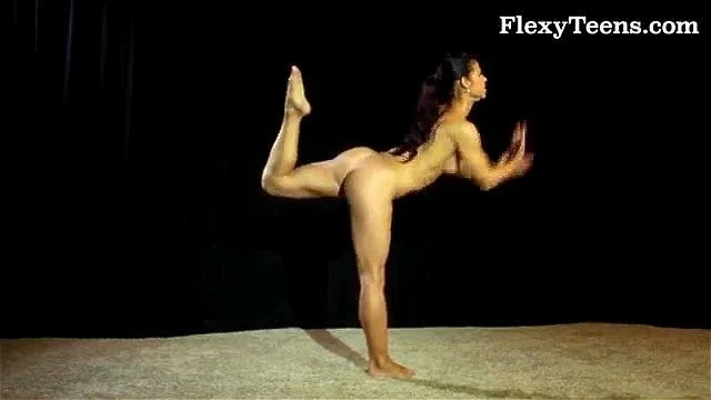 Fit naked gymnast dancing