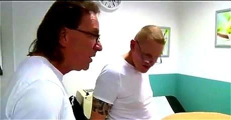 Husband waits while wife is examined