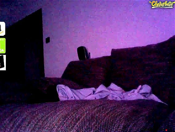 Brunette masturbating on a couch Brunette masturbating on a couch