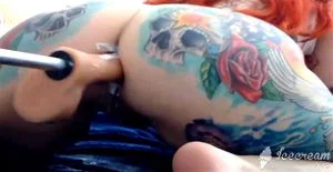 Tattooed girl pounding her asshole with fuck machine and squirt