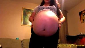 Massive Pregnant Woman in Tight Clothes