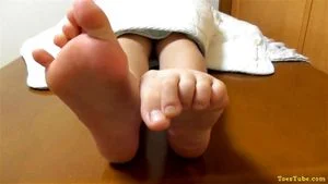Japanese girl shows her smooth soles