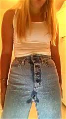 Blonde teen wetting her jeans