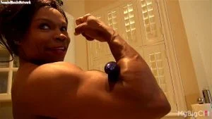 Sexy ebony muscle Milf with a large pink clit..