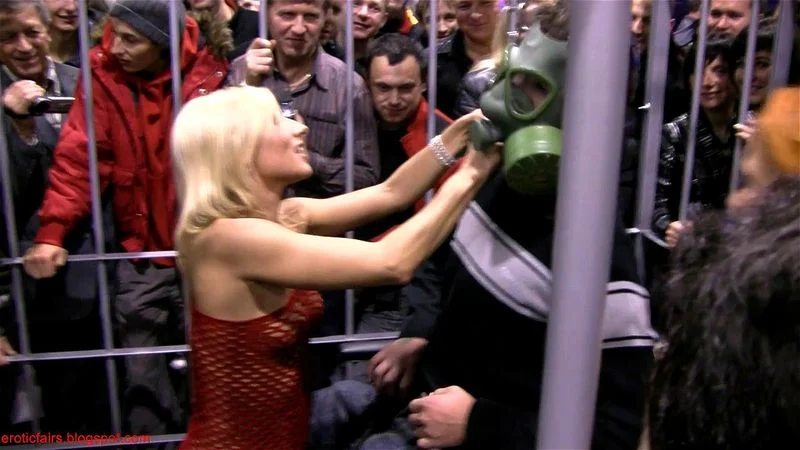 Public striptease show in a cage (2009)