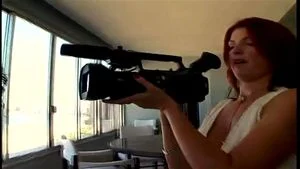 Reluctant redhead camera woman gets pulled into porn set sex