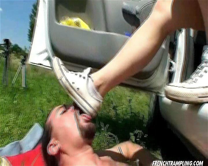 white converse licking under car