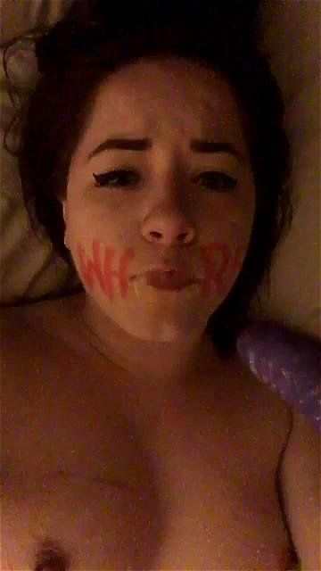 Gagging whore writes whore on her face