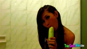 Asian teen and cucumber