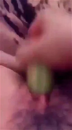 Amateur playing with cucumber